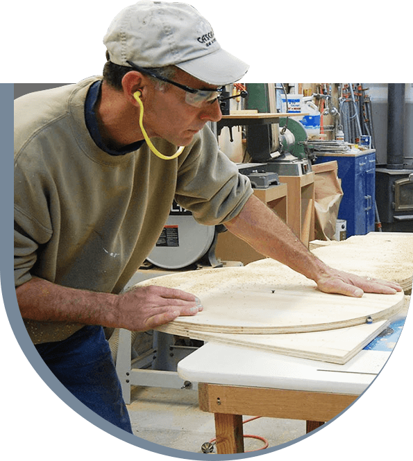 A man working on a project in a workshop.